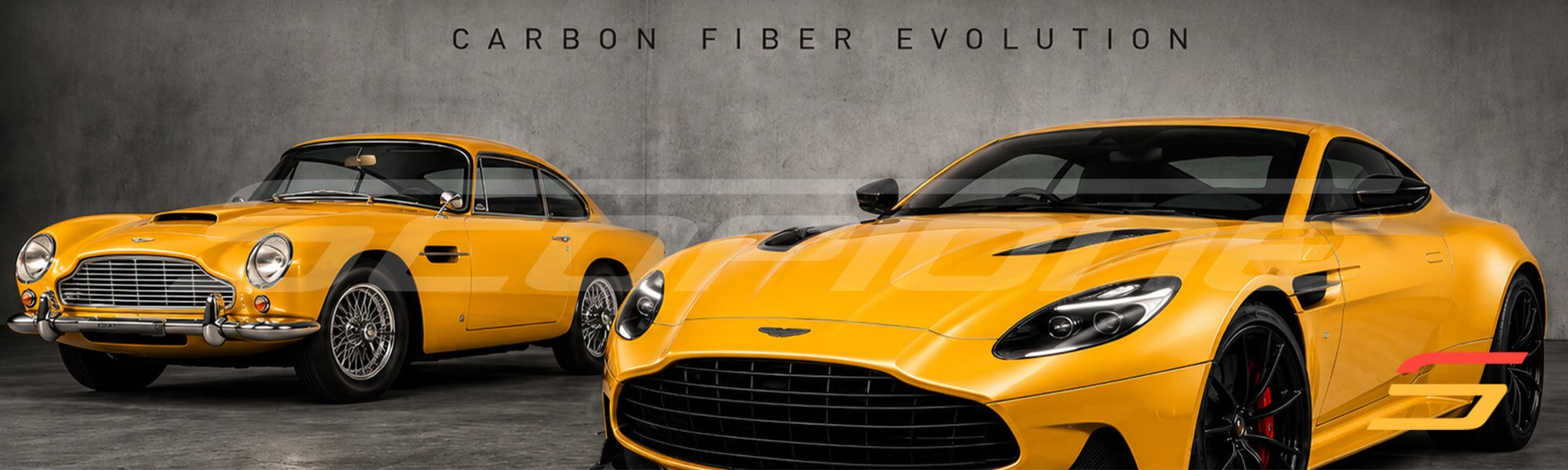 Carbon fiber evolution – classic Aston Martin DB5 beside a modern Aston Martin grand tourer