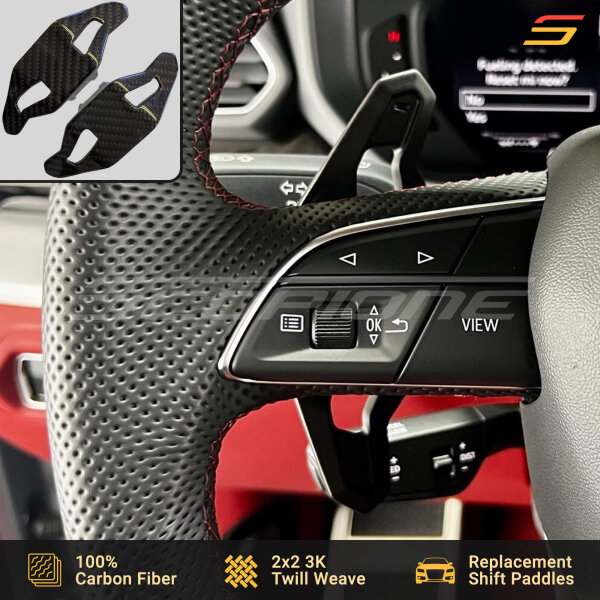 Scopione carbon fiber paddle shifters installed on Lamborghini Urus steering wheel