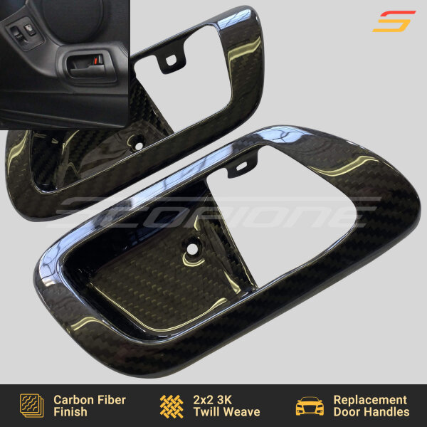 Carbon fiber door handle trim on Toyota Supra MK4 (A80), fitting seamlessly with the factory interior.